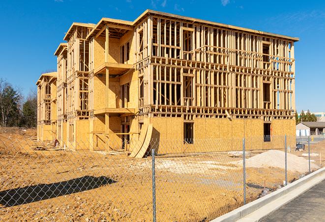 construction zone secured with a temporary fence, marked with warning signs in Country Club Hills IL